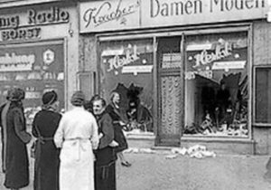 women in front of store with smashed windows Kristallnacht